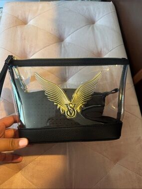 Clear Cosmetic Pouch with Gold Wing Emblem
